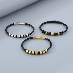 Detailed close-up of woven leather bracelets with gold, silver, and black magnetic clasps