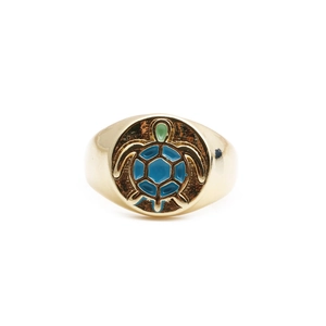 Golden sea turtle ring with vibrant blue and green enamel details on white background