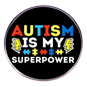 Black enamel Autism is my Superpower lapel pin with colorful puzzle piece design