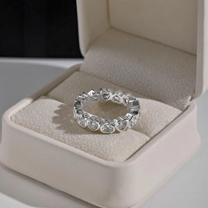 Detailed close-up of S925 sterling silver heart eternity ring in a premium jewelry box