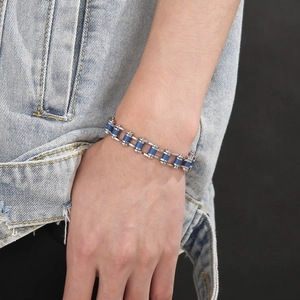 Close-up of industrial bicycle chain bracelet in silver and blue stainless steel