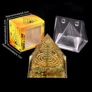 6cm Orgone Pyramid with green stones, gold foil, and metal coil in Egyptian style box