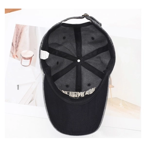 Detailed interior view of washed cotton baseball cap with 100% cotton label and metal buckle