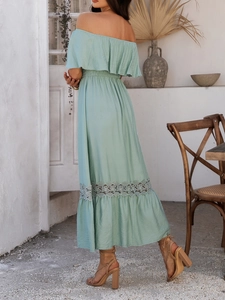 Detailed back view of a light green off-shoulder maxi dress with lace splice and ruffles