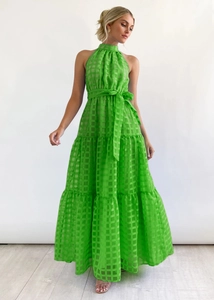 Detail of green checkered halter dress featuring tiered skirt and matching waist belt