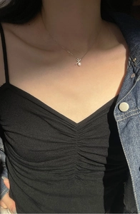 Detail view of s925 silver percentage pendant with freshwater pearl on a delicate chain