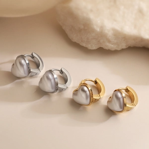 Minimalist heart-shaped stainless steel earrings in gold and silver finish set on stone