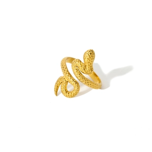 Detailed close-up of 18K gold snake ring showing intricate scale textures and spiral design