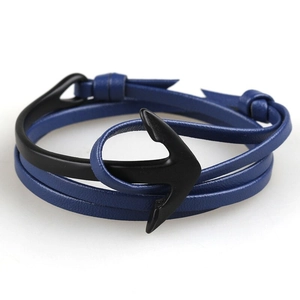Detail of multi-layer blue leather strap with a sleek black anchor hook clasp