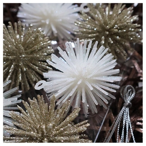 Detailed view of white and gold glitter star hanging ornaments for Christmas tree decor