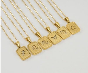 Detailed view of matte gold stainless steel square zodiac pendants with hollow signs