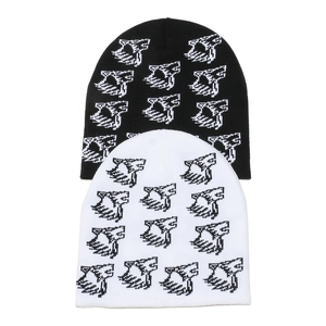 Winter knit beanies in black and white featuring pixelated wolf head jacquard patterns