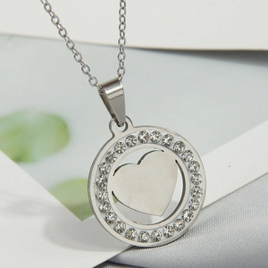 Polished stainless steel tree of life necklace with sparkling rhinestones and heart charm