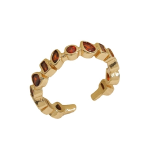 Adjustable 14K gold plated ring featuring vintage mixed-cut ruby zircon stones on a white background