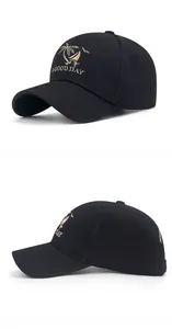 Close-up of black baseball cap with gold embroidered coconut tree and A Good Day text