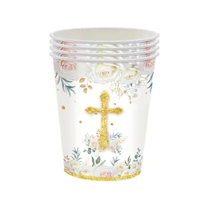 Detailed view of white disposable paper cups with golden cross and floral rose patterns