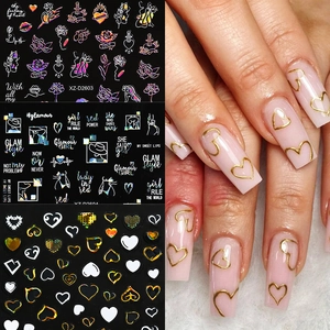Detail of Valentine heart nail stickers featuring gold line art and floral patterns