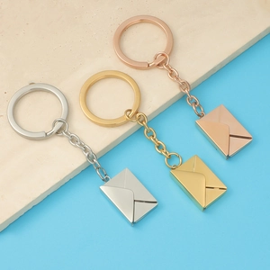 Polished stainless steel envelope lockets in silver, gold, and rose gold finishes