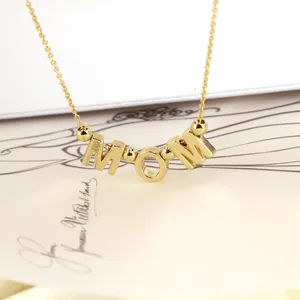 Golden Mom letter necklace with metallic beads on a white card for Mother's Day gift
