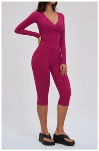 Fuchsia fited yoga set detail showing long sleeve wrap top and high waist leggings