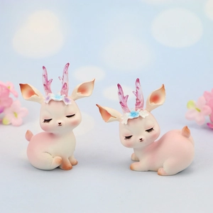 Pink and white gradient resin deer figurines with floral headbands for cake toppers