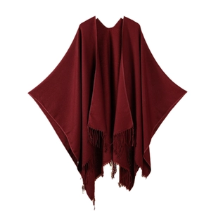 Deep red V-neck poncho shawl for women with elegant tassel hem on white background