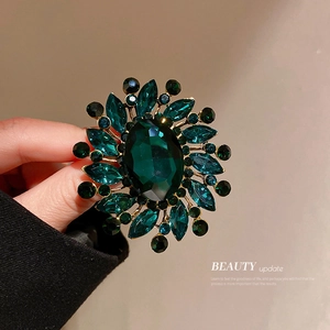 Vintage emerald sunflower brooch with green crystals and gold finish for women