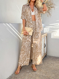 Detail view of khaki Bohemian short-sleeve shirt and wide-leg pants with abstract prints