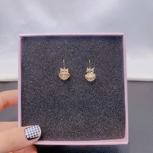 Elegant gold bow earrings with shell design, pearl inlay and zircon accents for women