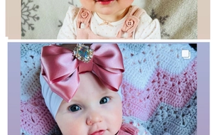 Close-up of pink satin bow baby headband with large multi-faceted sparkling gemstone