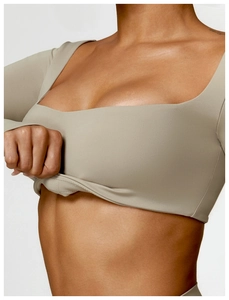 Close-up of khaki square neck yoga top showing seamless knit fabric and elastic fit