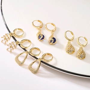 Luxury 18K gold plated geometric earrings collection featuring leaf and sapphire motifs