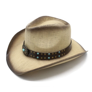 Close-up of straw cowboy hat with leather band, turquoise studs, and floral metal buckle