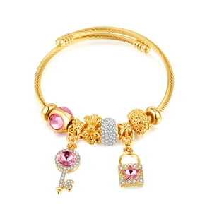 Adjustable gold plated charm bracelet with pink stone key and lock pendants