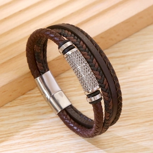 Close-up of multilayer braided leather men's bracelet with silver magnetic metal clasp