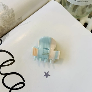French style acetate hair claw clip with blue and pink stripes on white background