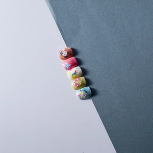 Detailed 5D relief nail art stickers featuring cute cartoon snails, butterflies and flowers