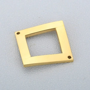 Golden hollow square stainless steel connector pendant for jewelry making on grey background