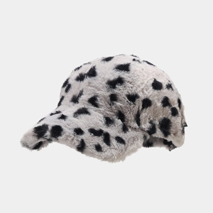 Detail of soft faux fur baseball cap featuring a stylish black and white leopard print design