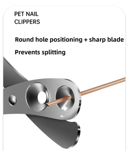 Close-up of double-hole stainless steel cat nail clipper showing sharp cutting edge
