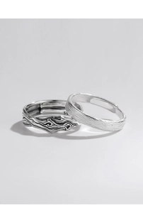 Detailed view of vintage textured silver rings with handcrafted metal finish and engraving