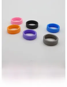Close-up of flexible silicone luggage wheel protectors in six assorted colors