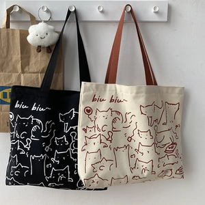 Artistic cat illustration canvas tote bags in black and beige with biu biu lettering