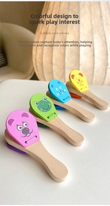Set of four colorful wooden castanets with cute cartoon animal prints for kids