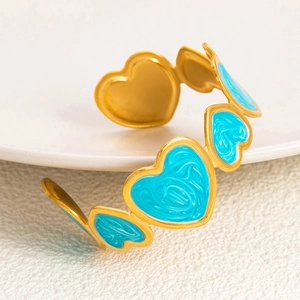 Golden 18K plated stainless steel bangle with sky blue marble enamel hearts