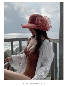 Detail showing the intricate organza flower decor on a wide brim beach sun hat for women