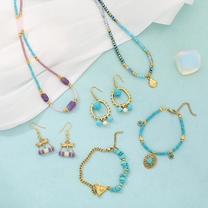 Bohemian jewelry set with turquoise beads, purple stones, and dragonfly charms