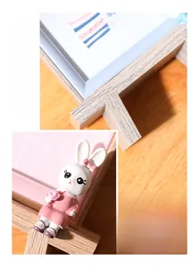 Close-up of a cute 3D bunny decoration on a Nordic style wooden photo frame texture