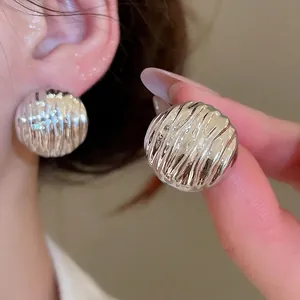 Silver wrinkled disc earrings with textured ripple metal surface for women