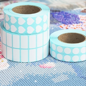 Three rolls of blue diamond painting DIY stickers in heart, round and rectangle shapes